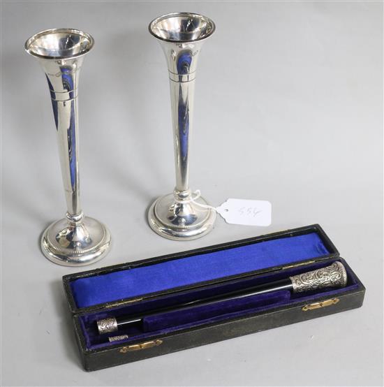 A cased silver mounted conductors baton and a pair of silver spill vases.